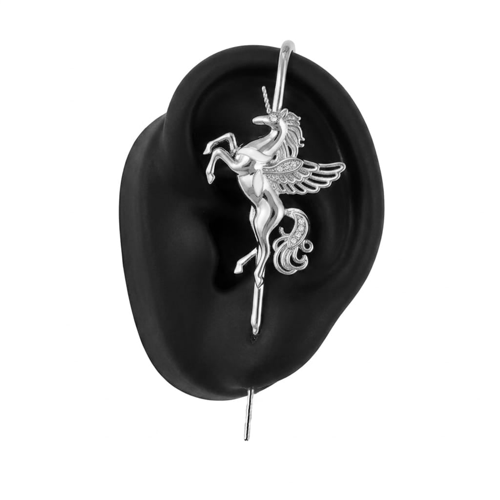Pegacorn ear cuff in silver on a black ear form