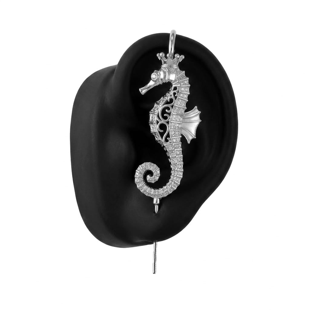 Imperial Seahorse ear cuff in silver on a black ear form