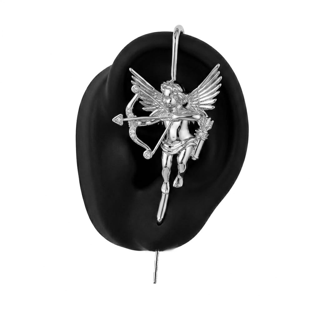 Cupid ear cuff in silver on a black ear form