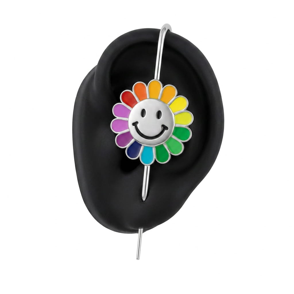 Rainbow Flower ear cuff in silver on a black ear form