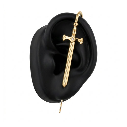 Titan's Edge ear cuff in gold on a black ear form