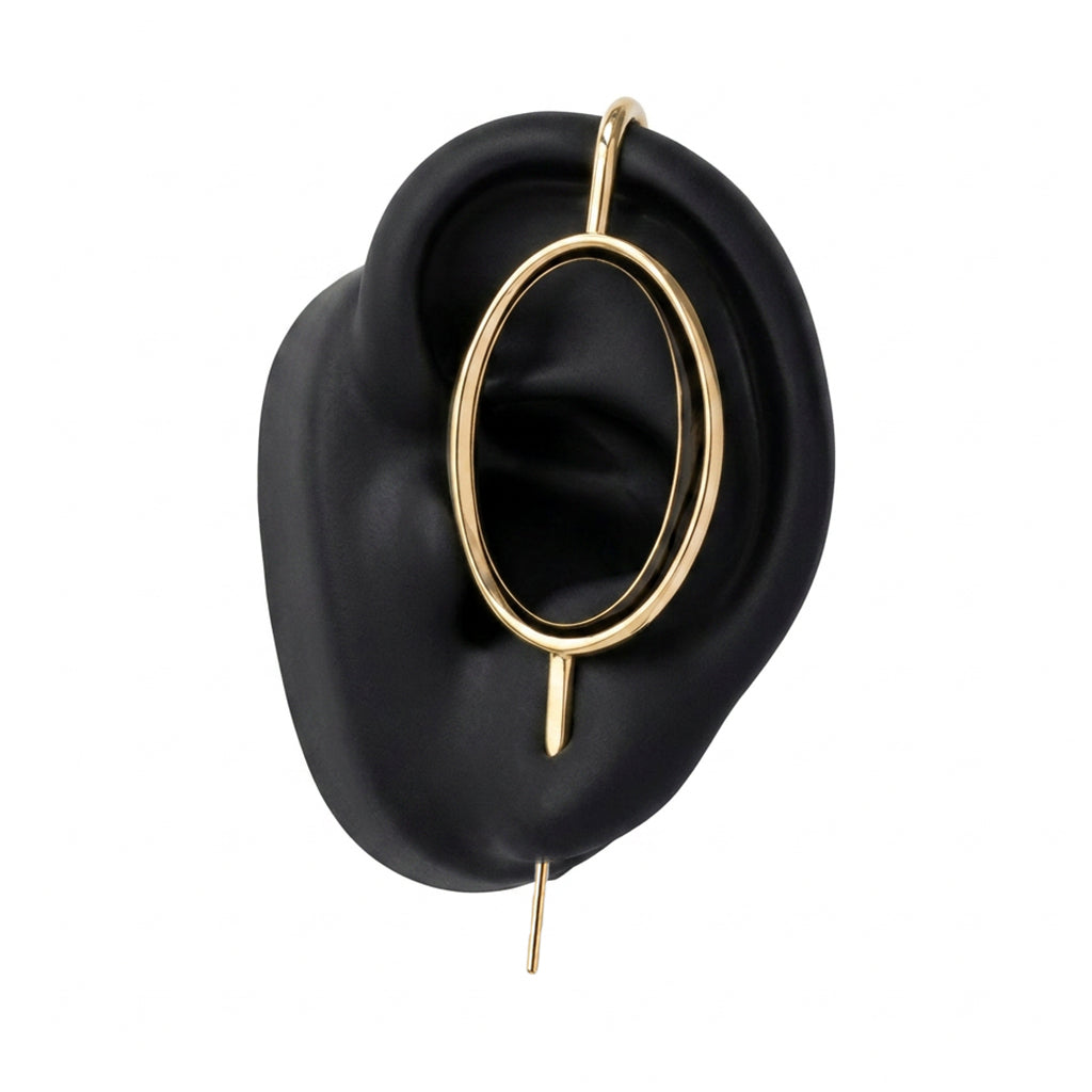Halo ear cuff in gold on a black ear form