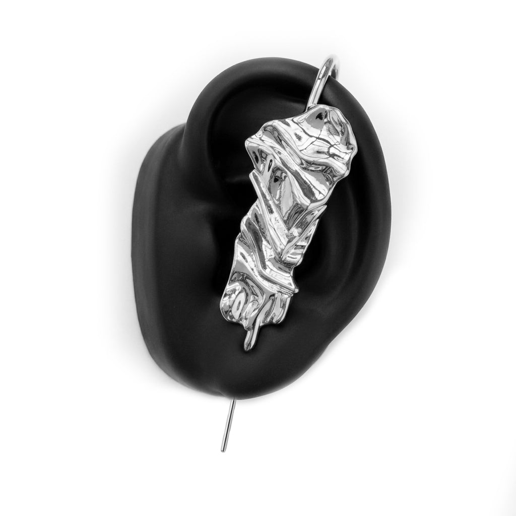 Sculpted Cascade ear cuff in silver on a black ear form