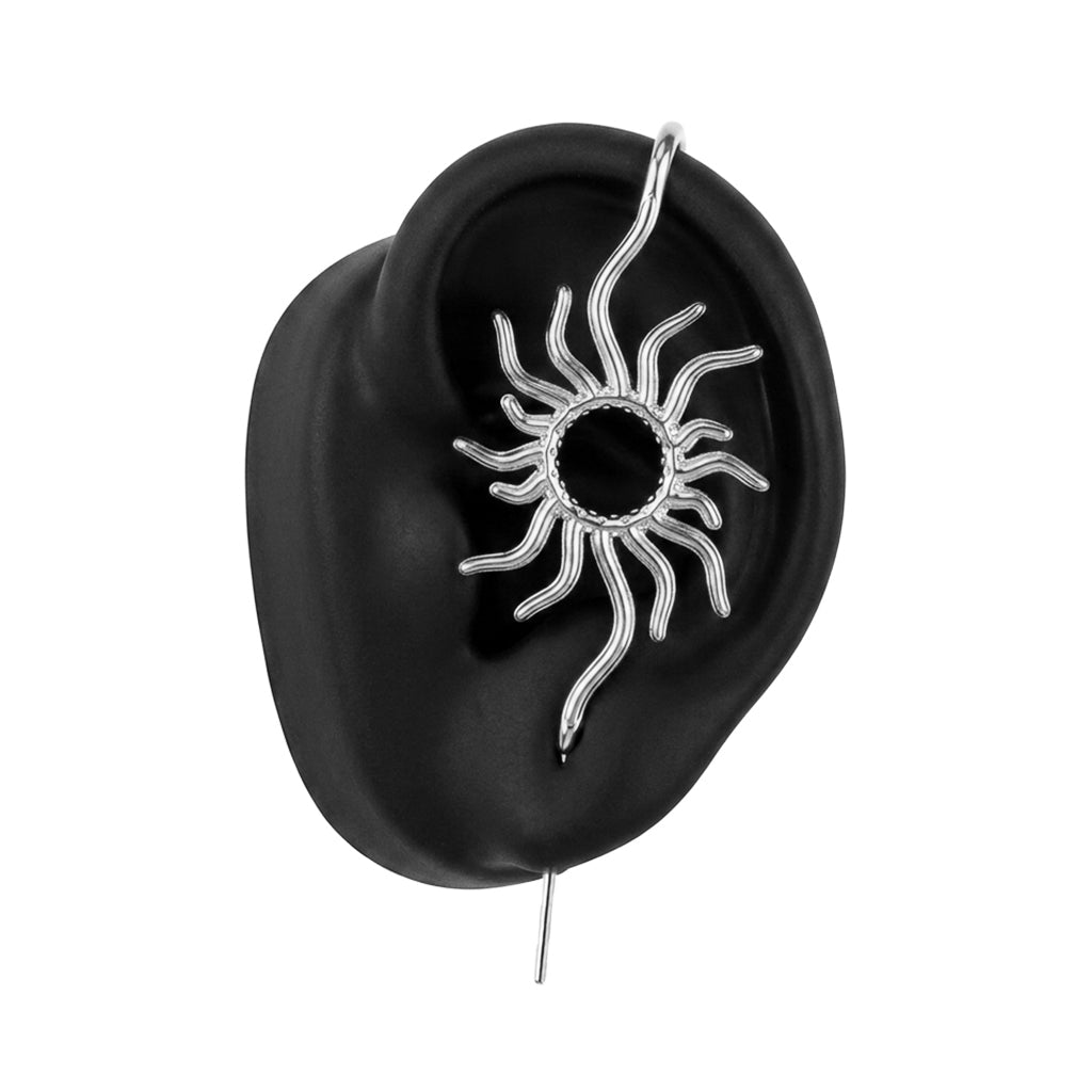 Sunfire ear cuff in silver on a black ear form