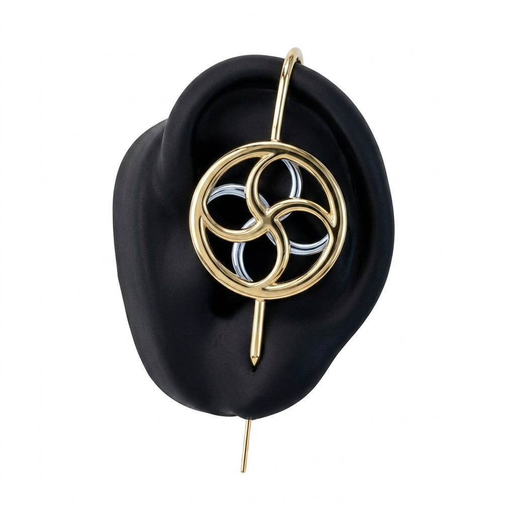 Kinetic Loop ear cuff in gold on a black ear form