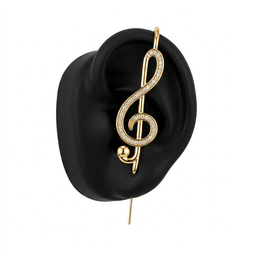 Treble Clef ear cuff in gold on a black ear form