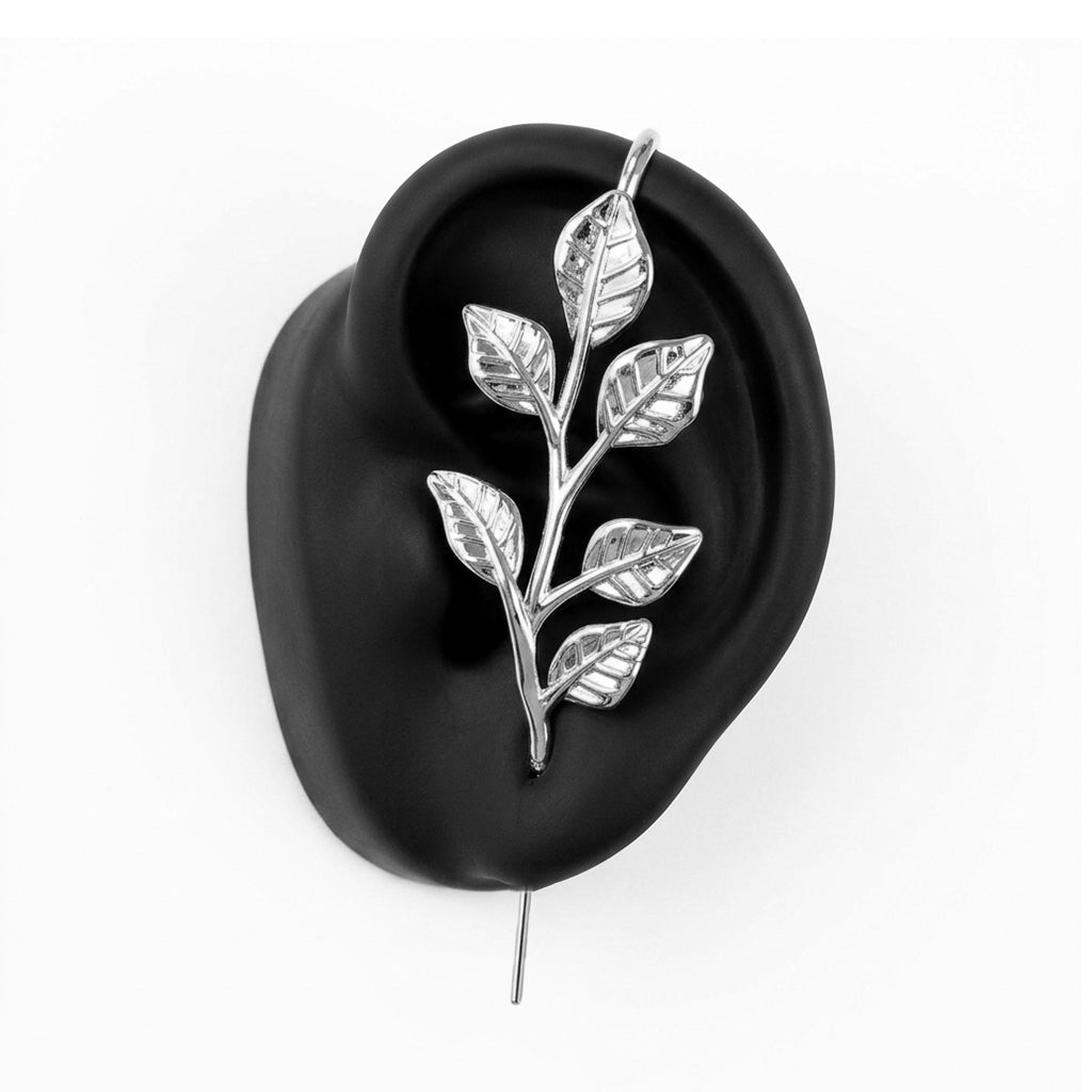 Whispering Leaves ear cuff in silver on a black ear form