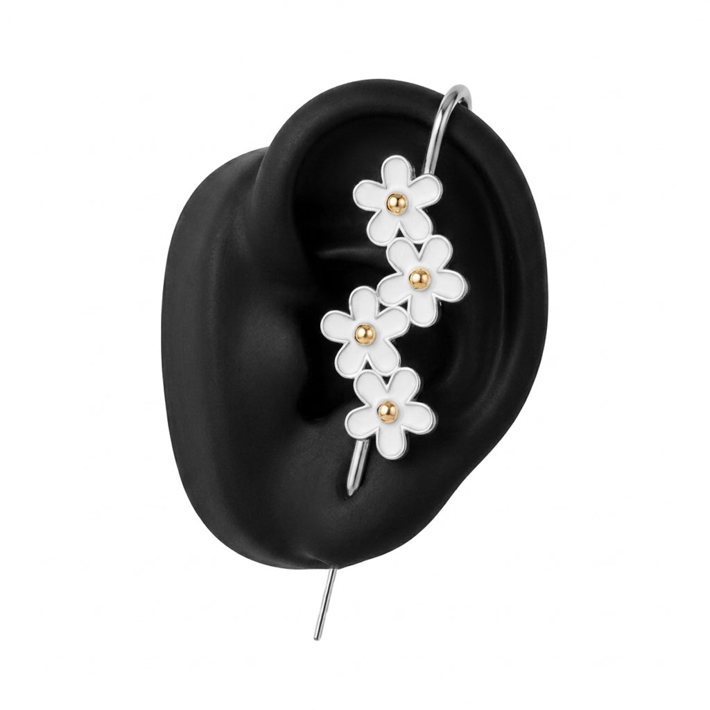 Daisy Flower ear cuff in silver on a black ear form