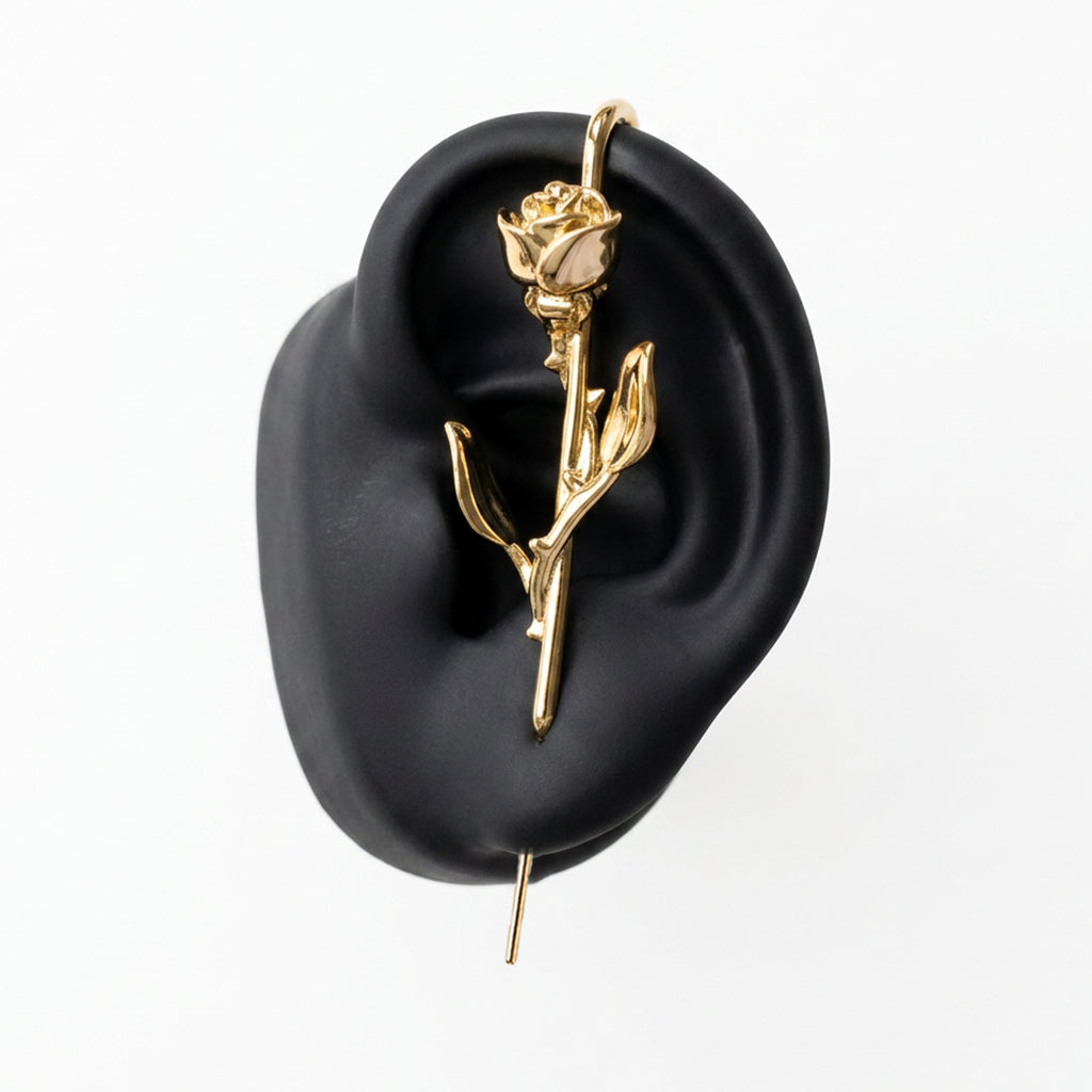 Radiant Rose ear cuff in gold on a black ear form