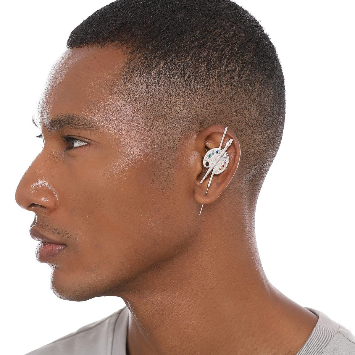 Artist ear cuff worn on the ear, profile view