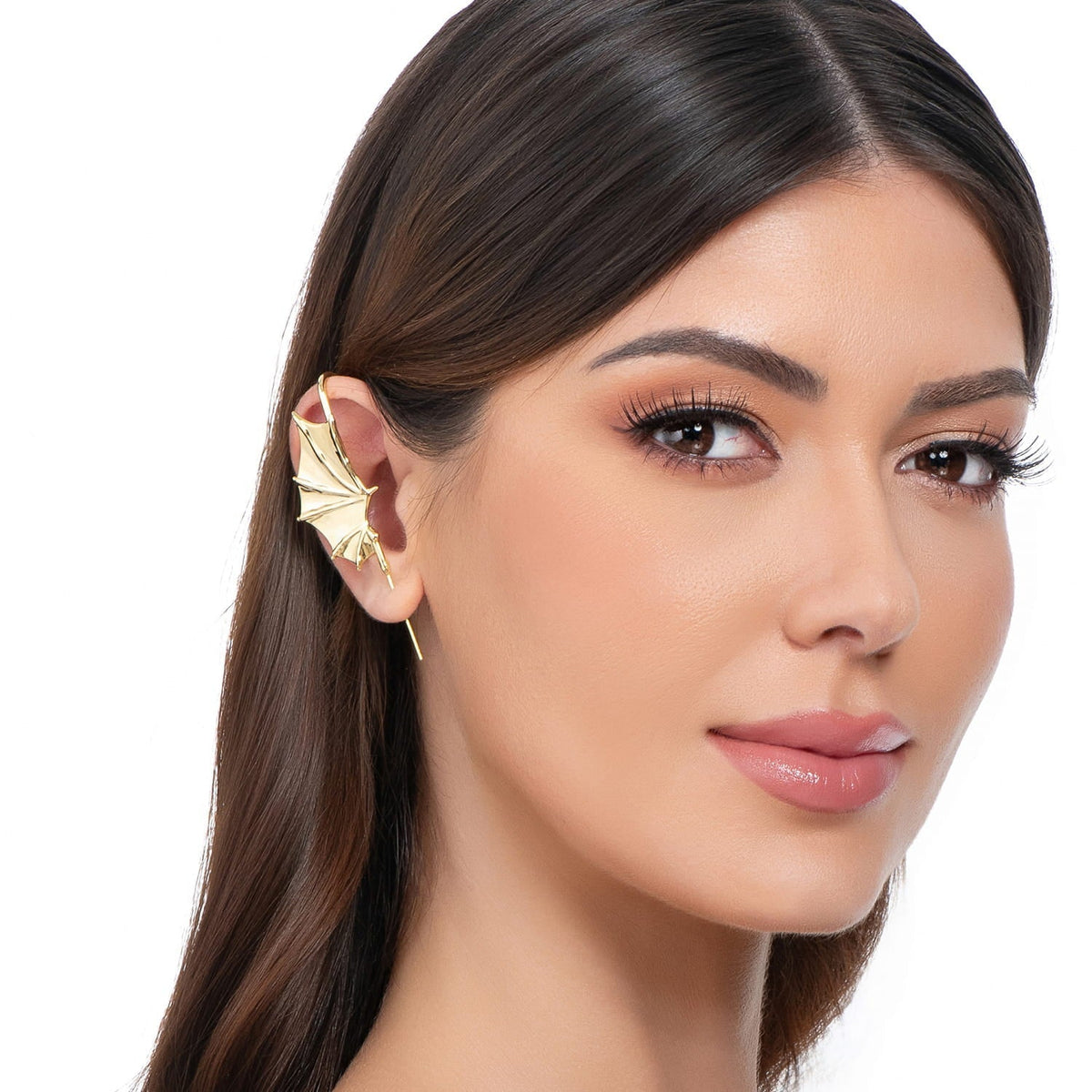 Nightfall Wings ear cuff in gold on a black ear form