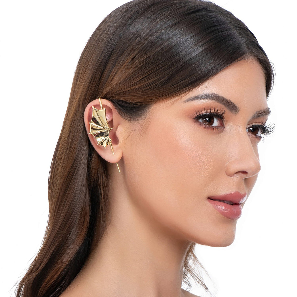 Nightfall Wings ear cuff in gold on a black ear form