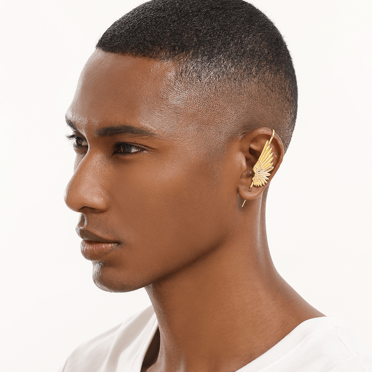 Celestial Wing ear cuff in gold worn on the ear, profile view