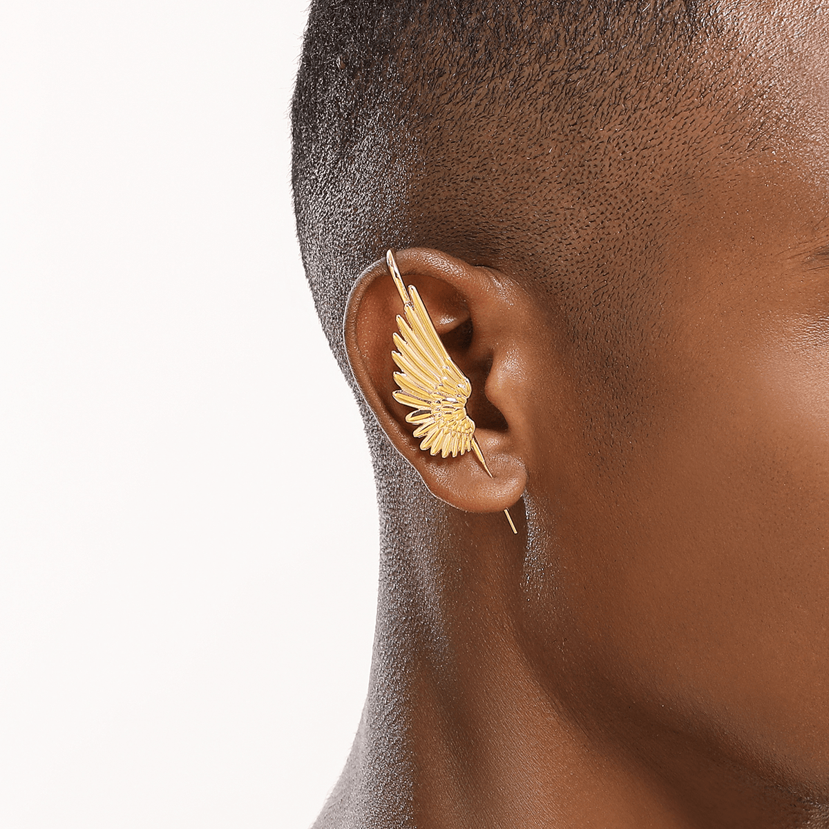 Celestial Wing ear cuff in gold worn on the ear, profile view
