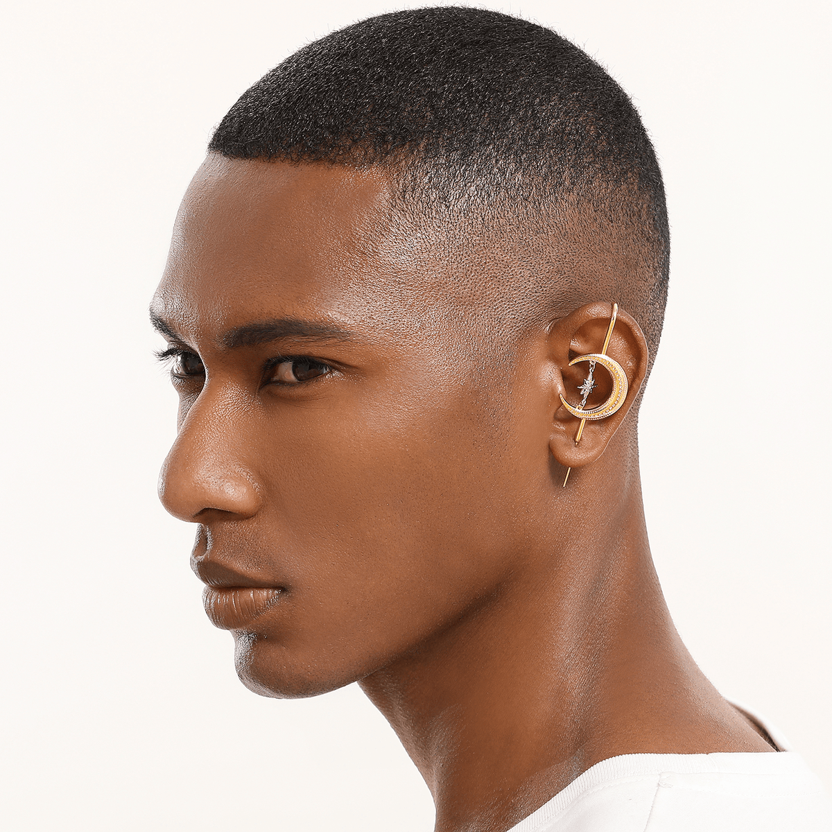 Cosmic Connection ear cuff in gold worn on the ear, profile view