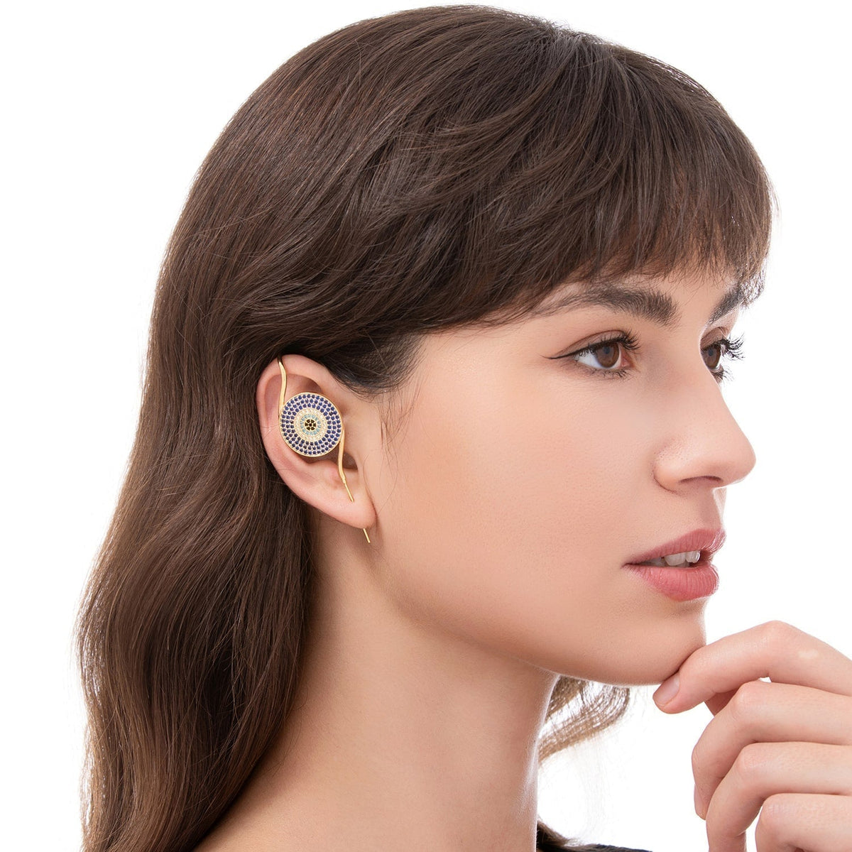 Evil Eye ear cuff worn on the ear, profile view