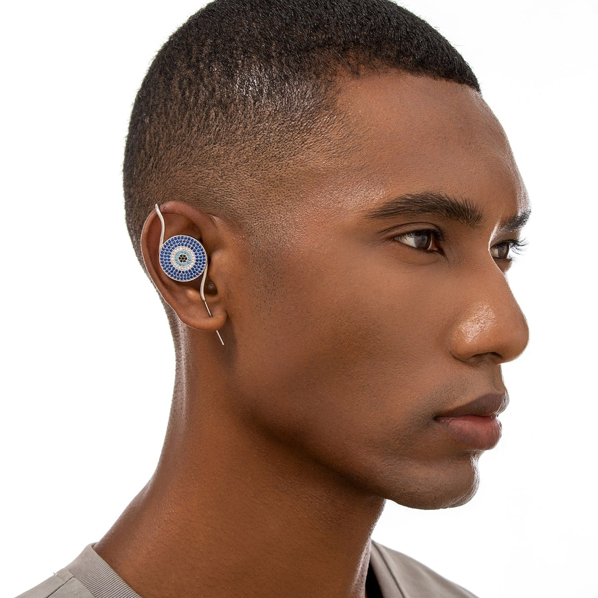 Evil Eye ear cuff worn on the ear, profile view