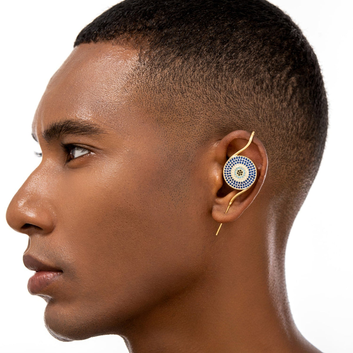Evil Eye ear cuff worn on the ear, profile view