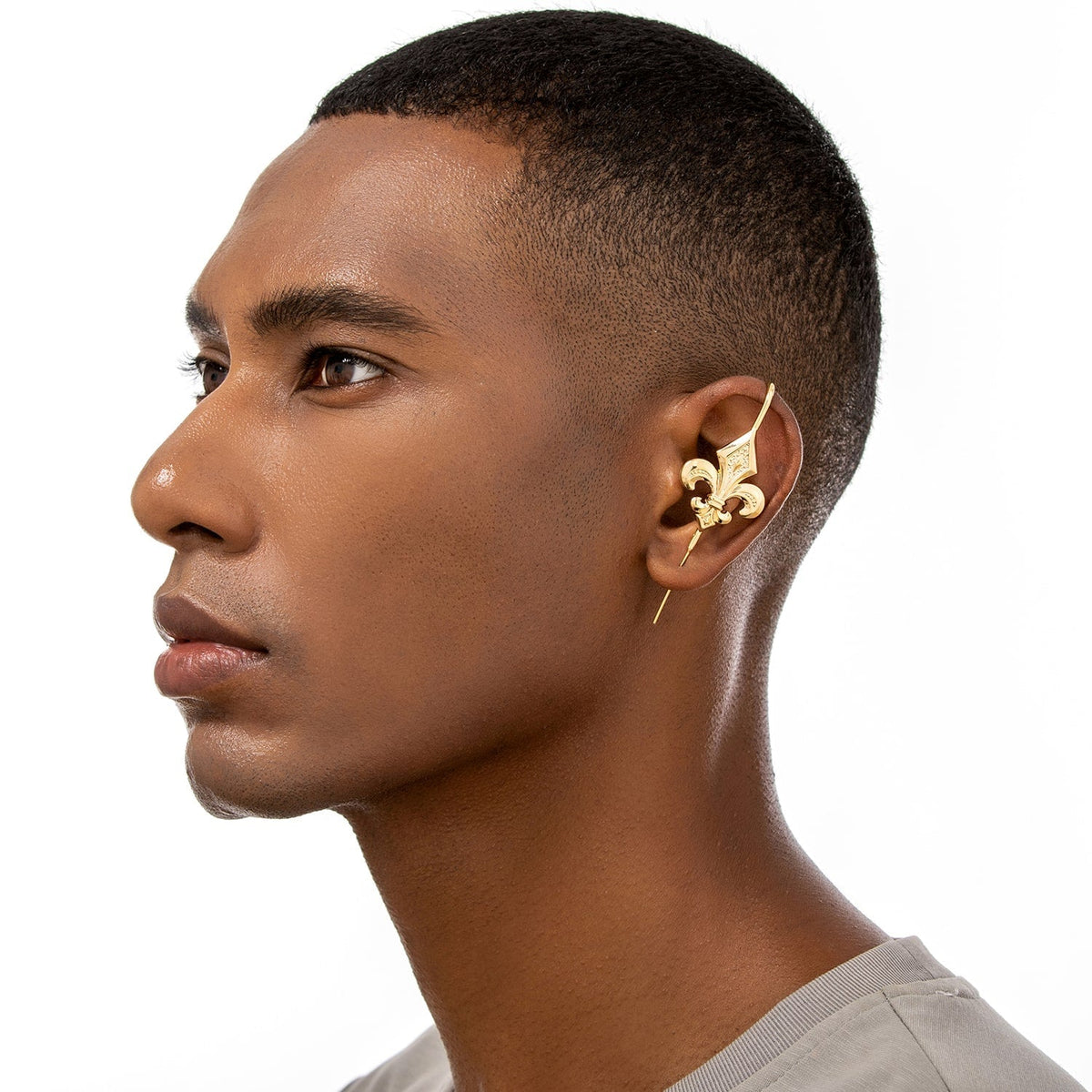 Fleur De Lys ear cuff worn on the ear, profile view