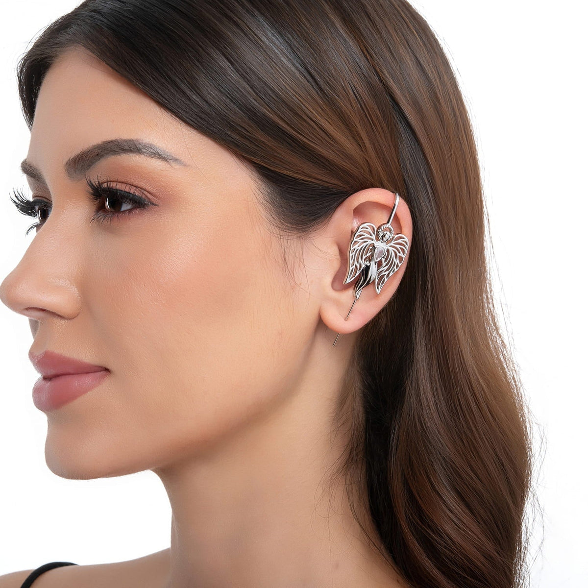 Guardian Angel ear cuff in silver on a black ear form