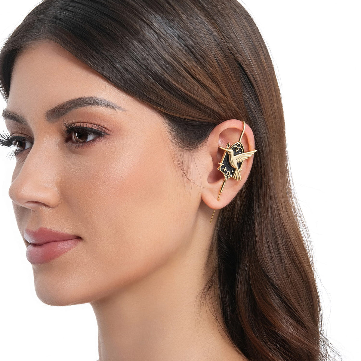 Hummingbird ear cuff in gold on a black ear form