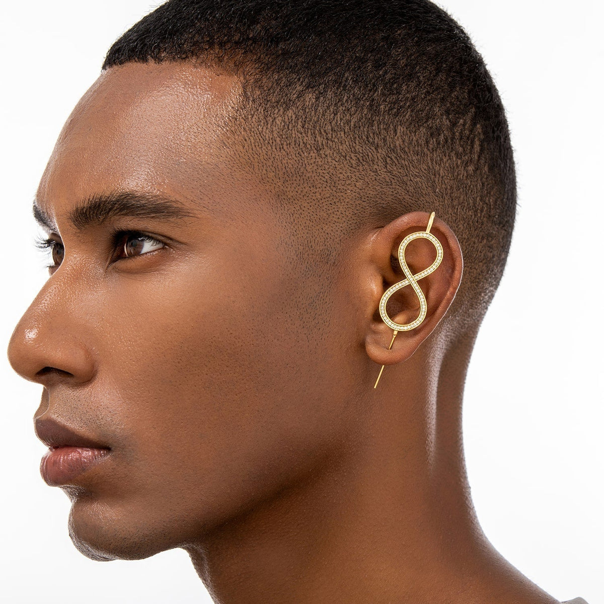 Infinity ear cuff worn on the ear, profile view