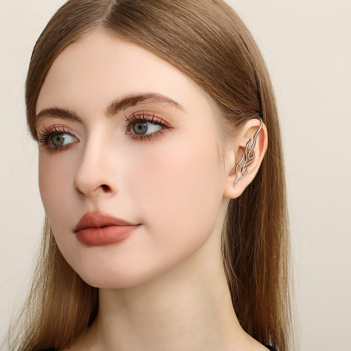 Inner Fire ear cuff worn on the ear, profile view