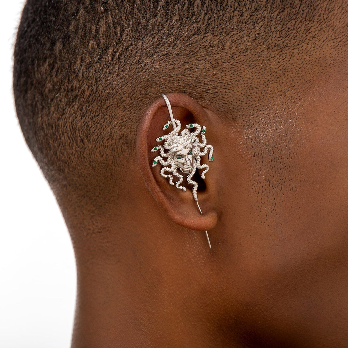 Medusa's Gaze ear cuff worn on the ear, profile view