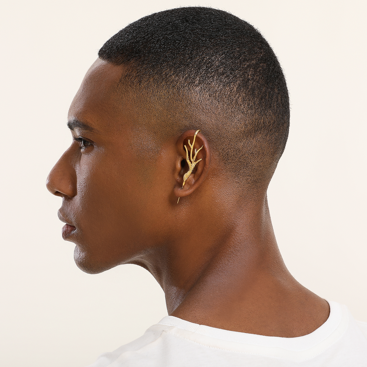 Nature's Embrace ear cuff in gold worn on the ear, profile view