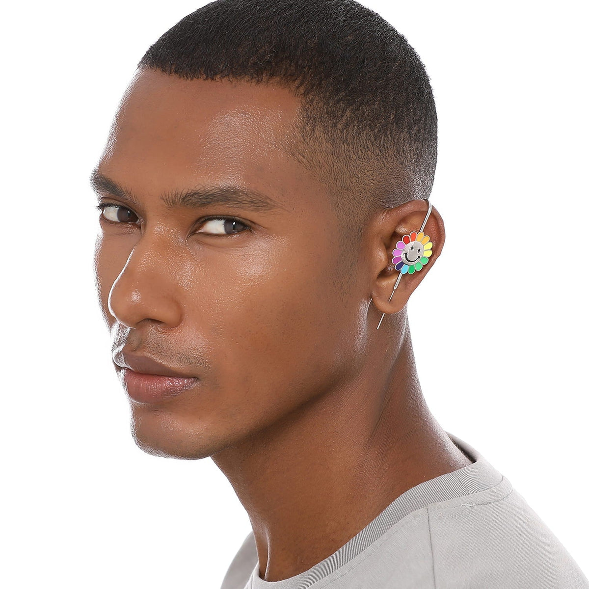 Rainbow Flower ear cuff worn on the ear, profile view