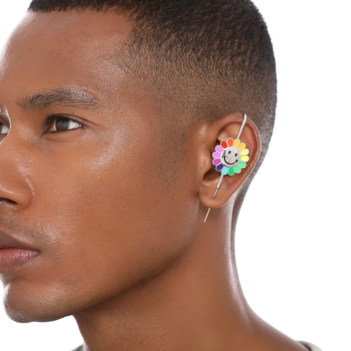 Rainbow Flower ear cuff worn on the ear, profile view
