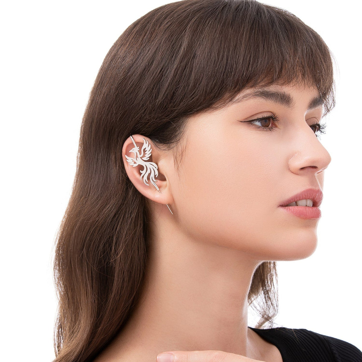 Rising Phoenix ear cuff worn on the ear, profile view