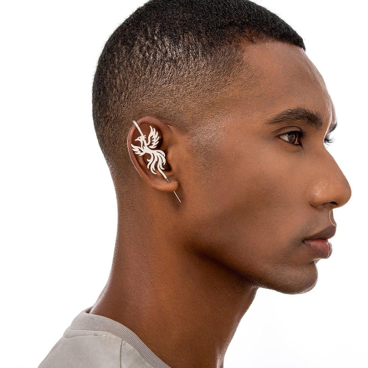 Rising Phoenix ear cuff worn on the ear, profile view