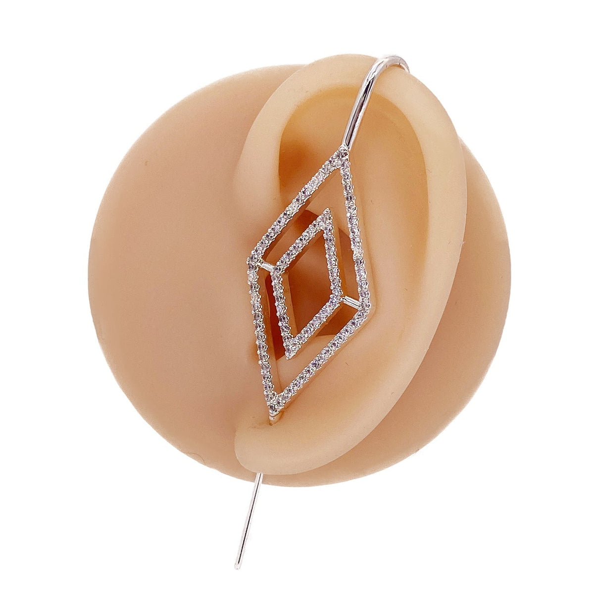 Diamond ear cuff in silver on a black ear form