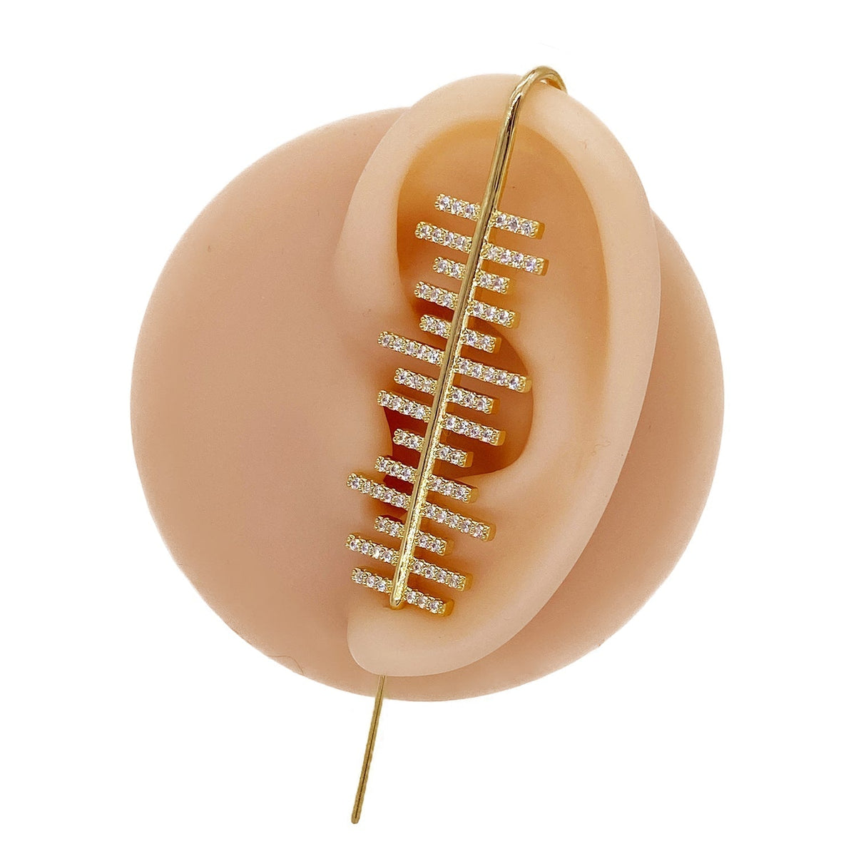Balance ear cuff in gold on a black ear form