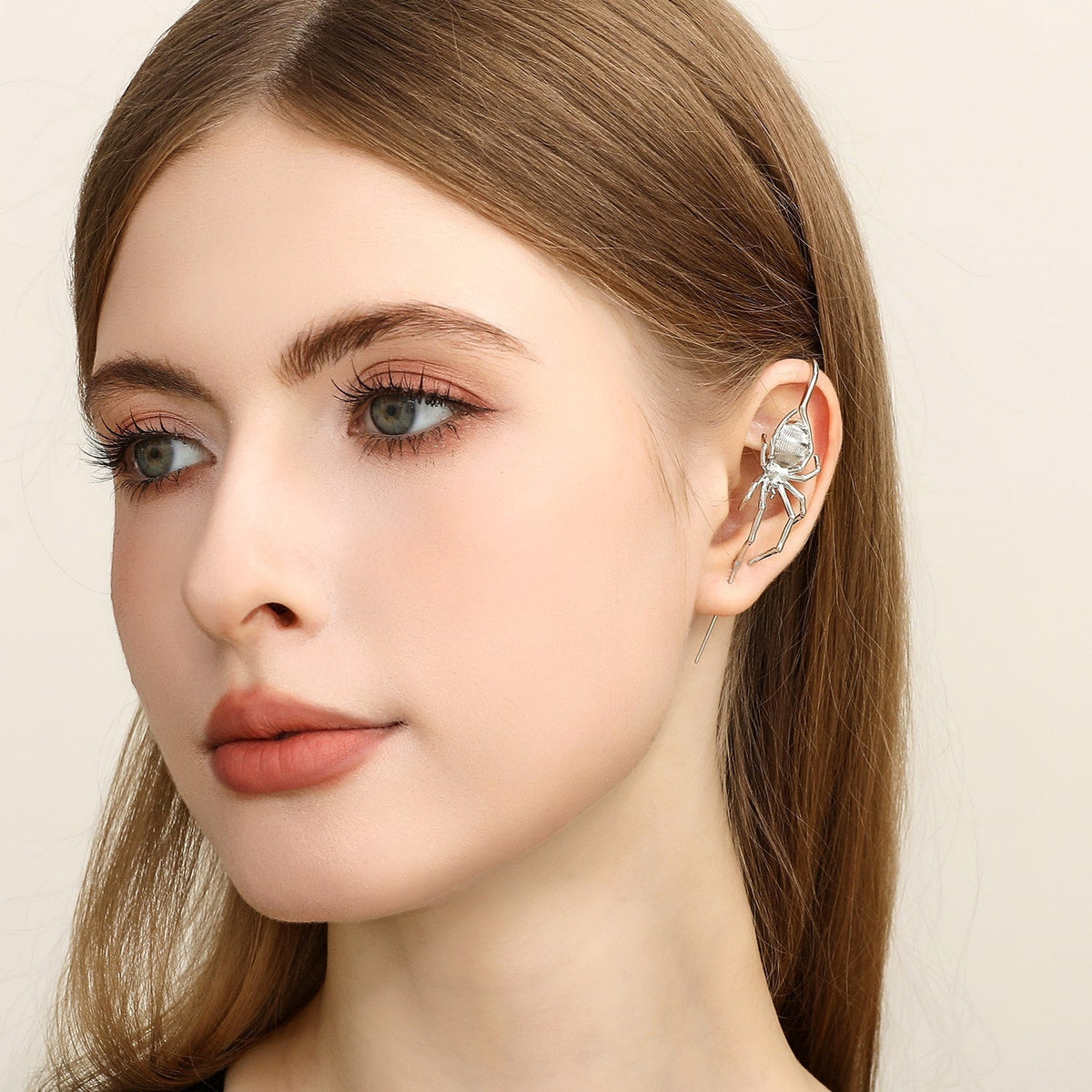 Arachnid Kiss ear cuff worn on the ear, profile view