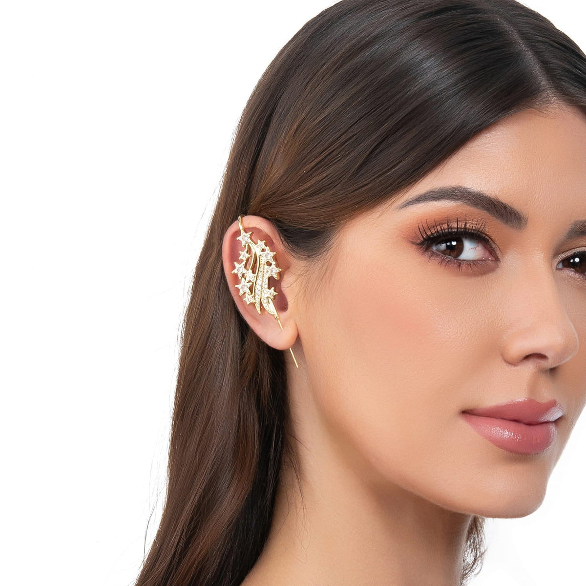 Starfall ear cuff in gold on a black ear form
