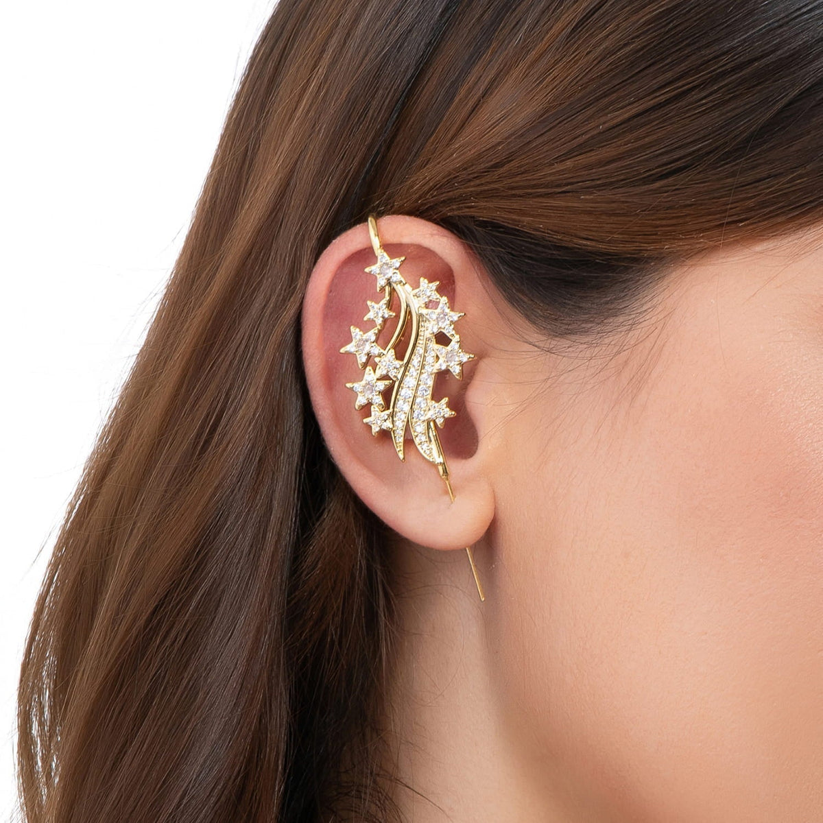 Starfall ear cuff in gold on a black ear form