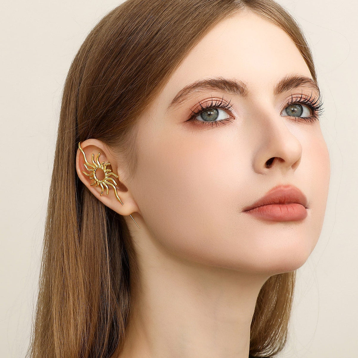 Sunfire ear cuff worn on the ear, profile view