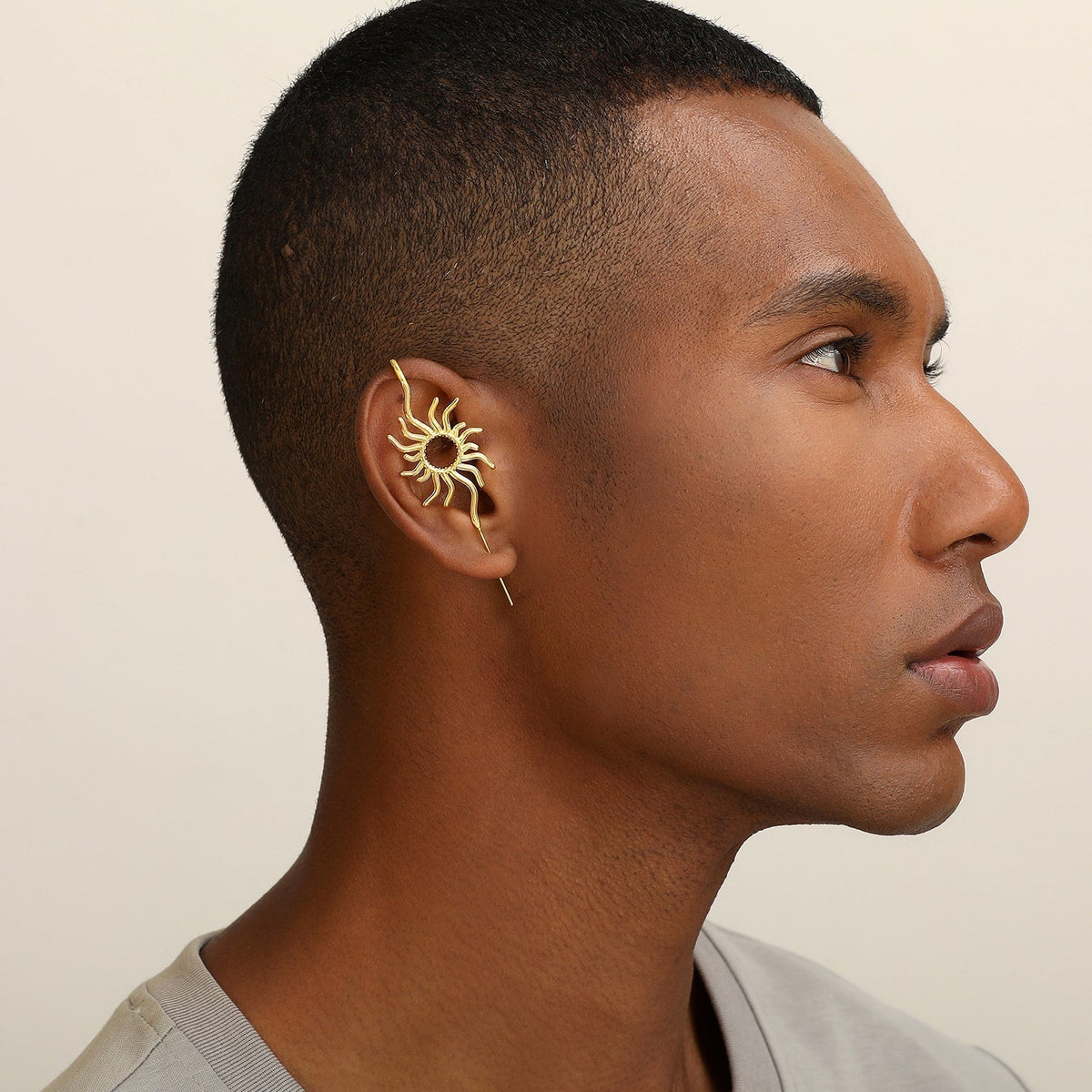 Sunfire ear cuff worn on the ear, profile view