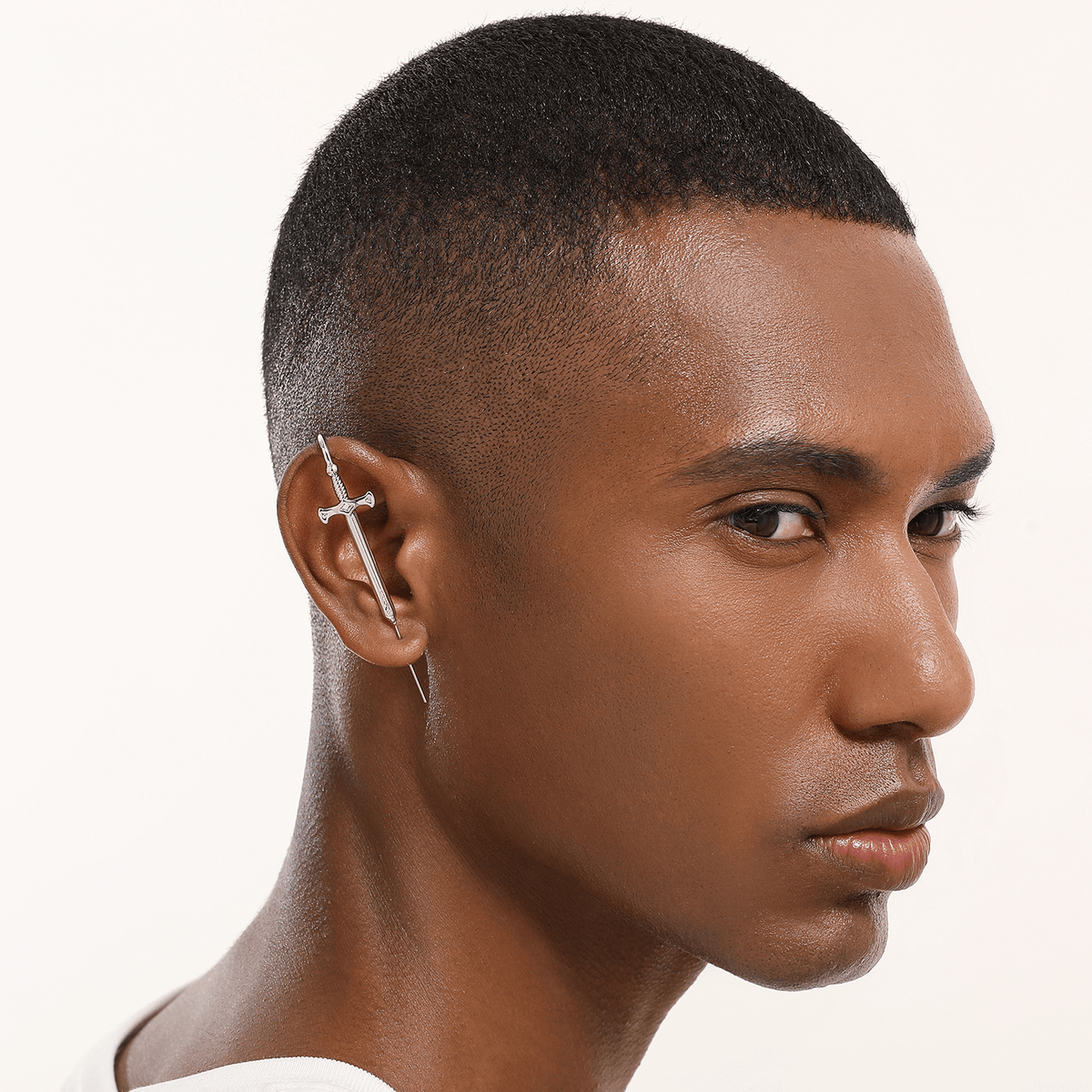 Titan's Edge ear cuff in silver worn on the ear, profile view