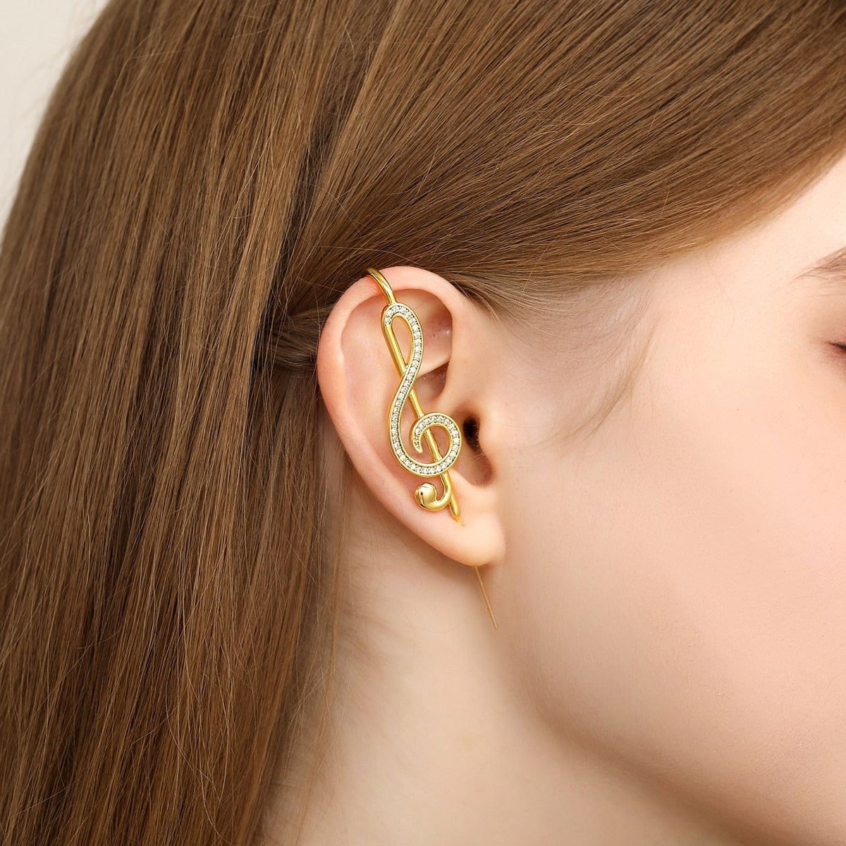 Treble Clef ear cuff worn on the ear, profile view