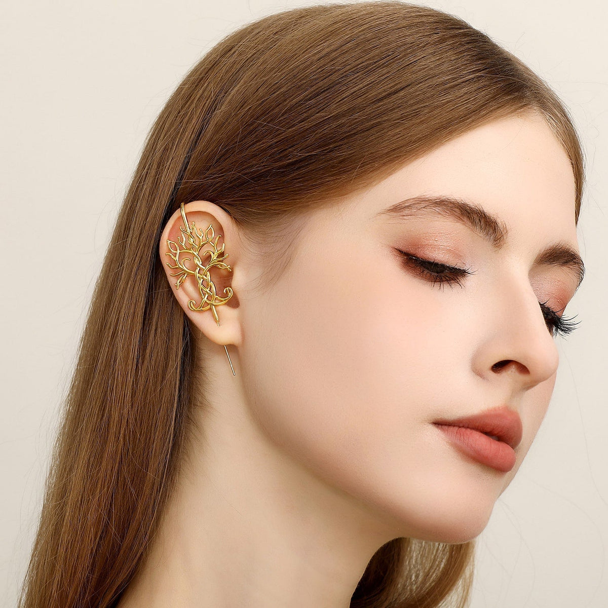 Tree of Life ear cuff worn on the ear, profile view