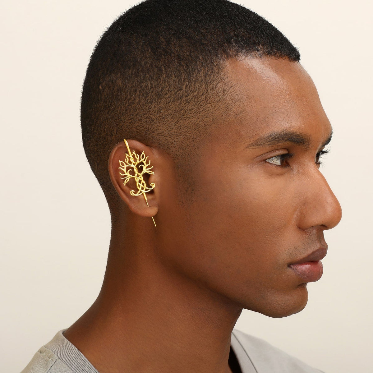 Tree of Life ear cuff worn on the ear, profile view