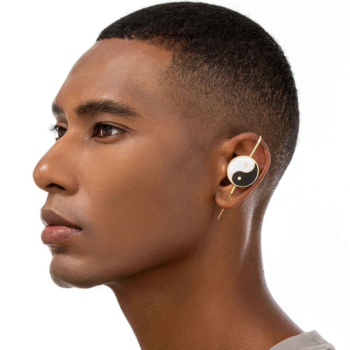 Yin & Yang ear cuff worn on the ear, profile view