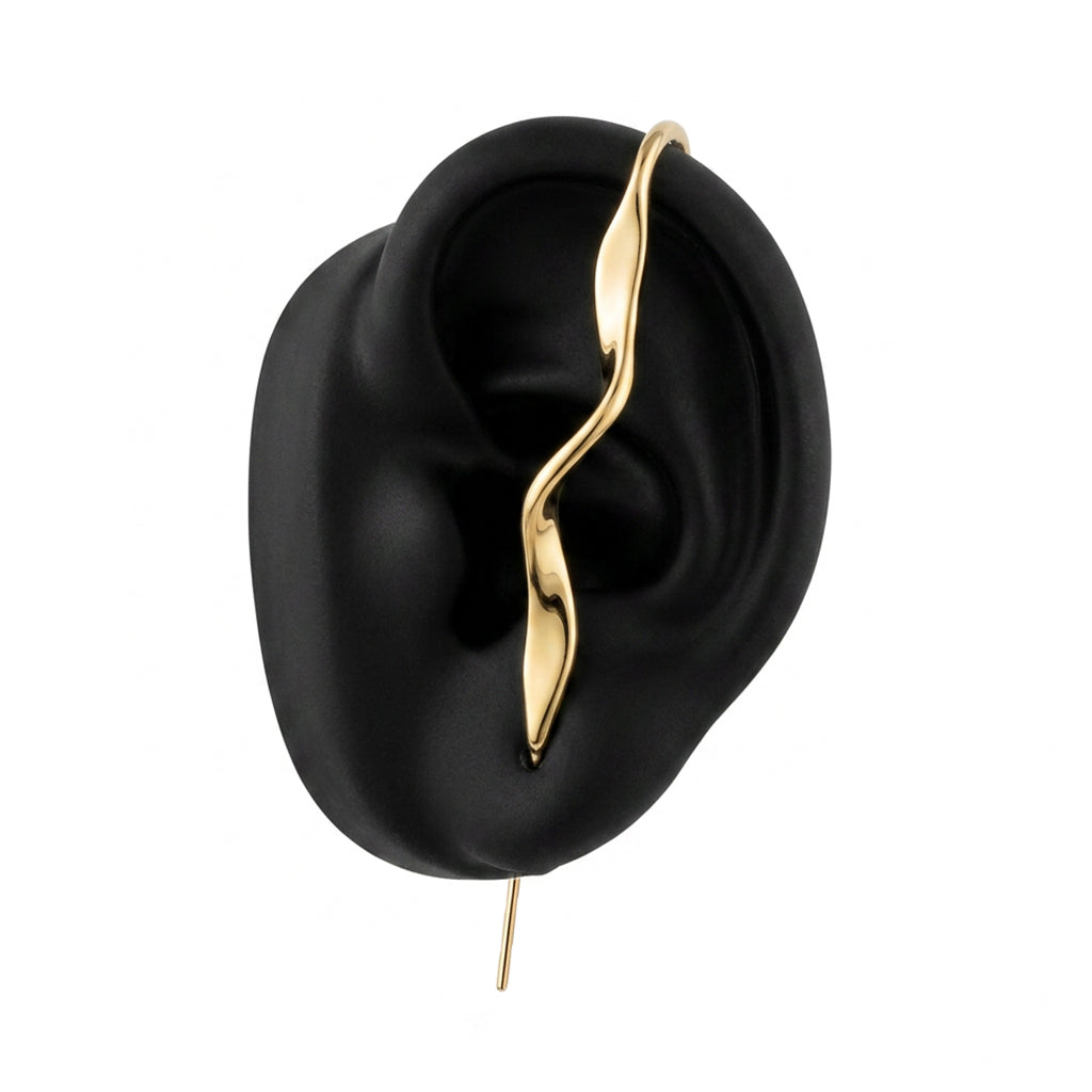 Twisted ear cuff in gold on a black ear form