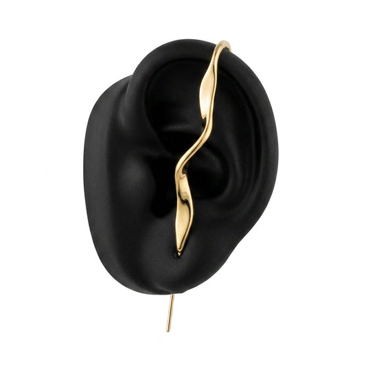 Twisted ear cuff in gold on a black ear form