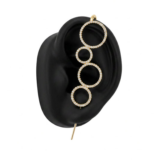 Linked Circles ear cuff in gold on a black ear form