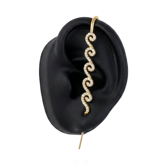 Ocean Waves ear cuff in gold on a black ear form