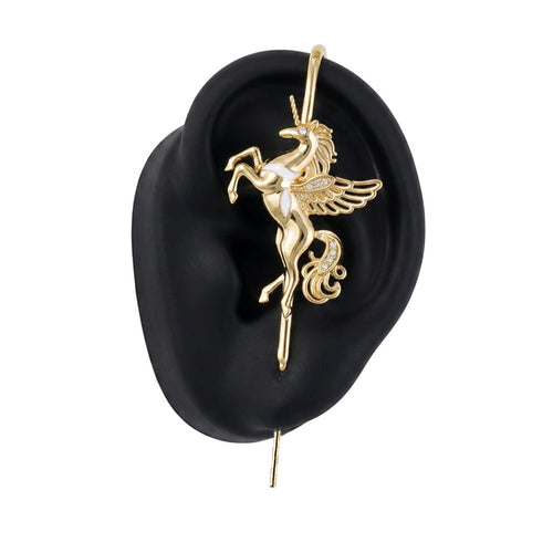 Pegacorn ear cuff in gold on a black ear form